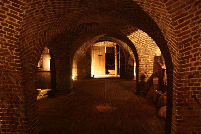 Charleston Ghost & Dungeon Night-Time Walking Tour with Entry to Provost Dungeon - Inside the Provost Dungeon at the Old Exchange