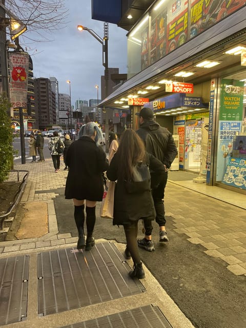 Expert Anime Guide in Akihabara with a maid witch - A Maid Witch Guide for Akihabara’s Otaku Core