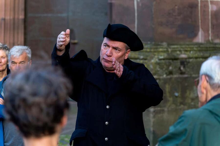 Freiburg: Acting tour "Witches, Torture, Stake" with Historix-Tours - Münsterplatz and the public face of fear