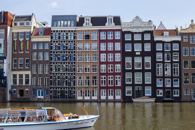 Guided Walking Tour Amsterdam - Legends, History & Ghost Stories - Central Station, a grand hotel, and Rembrandt’s gallows field