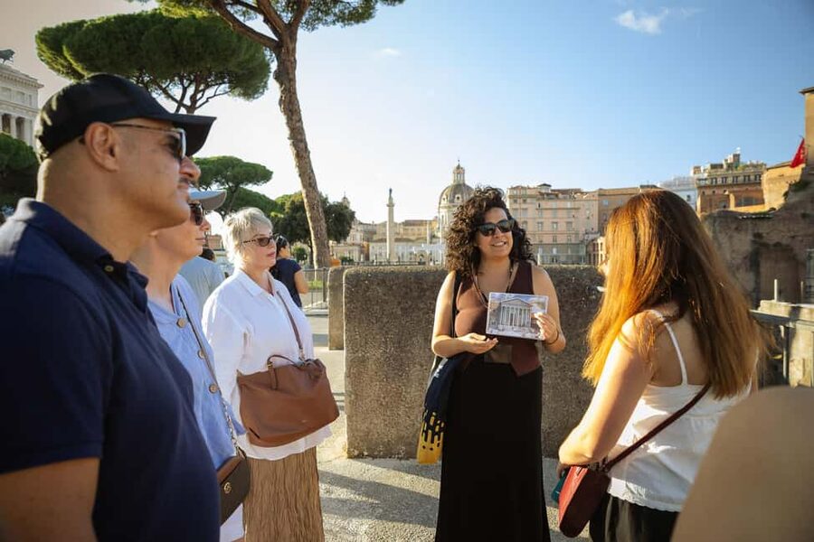 Rome: Colosseum and Ancient Dark History Walking Tour - Via dei Fori Imperiali: walking through a corridor of ruins