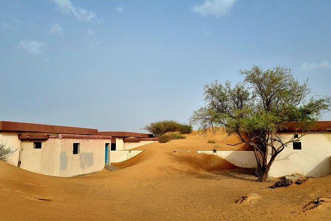 The Ghost Village Safari Tour with Dune Bashing and Sandboarding - Key Points at a Glance
