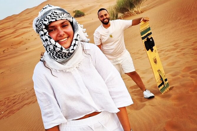 The Ghost Village Safari Tour with Dune Bashing and Sandboarding - Walking Through the Half-Buried Houses